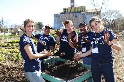 AmeriCorps members serving in community garden