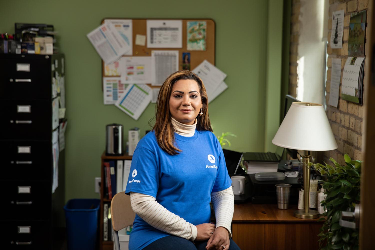 AmeriCorps member smiling in an office