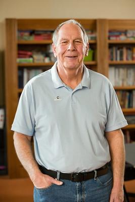 AmeriCorps Seniors volunteer smiling with hand in pocket.