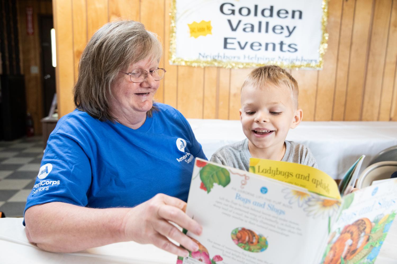 AmeriCorps Foster Grandparent Reads to Student