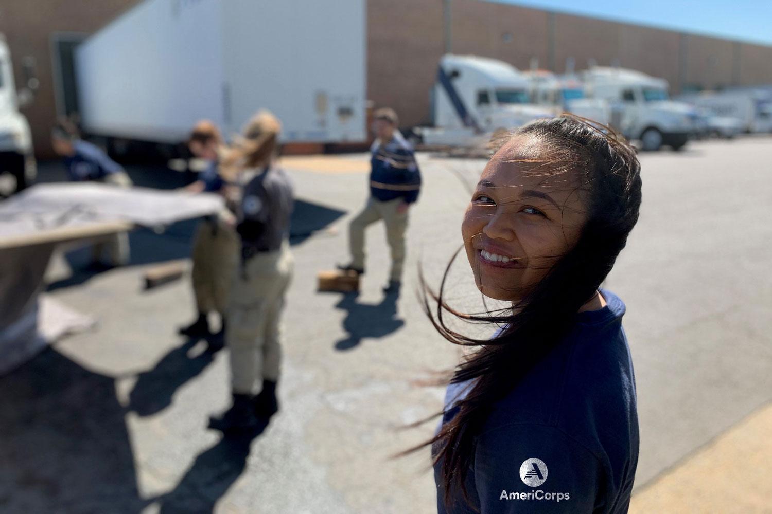 AmeriCorps volunteer smiling