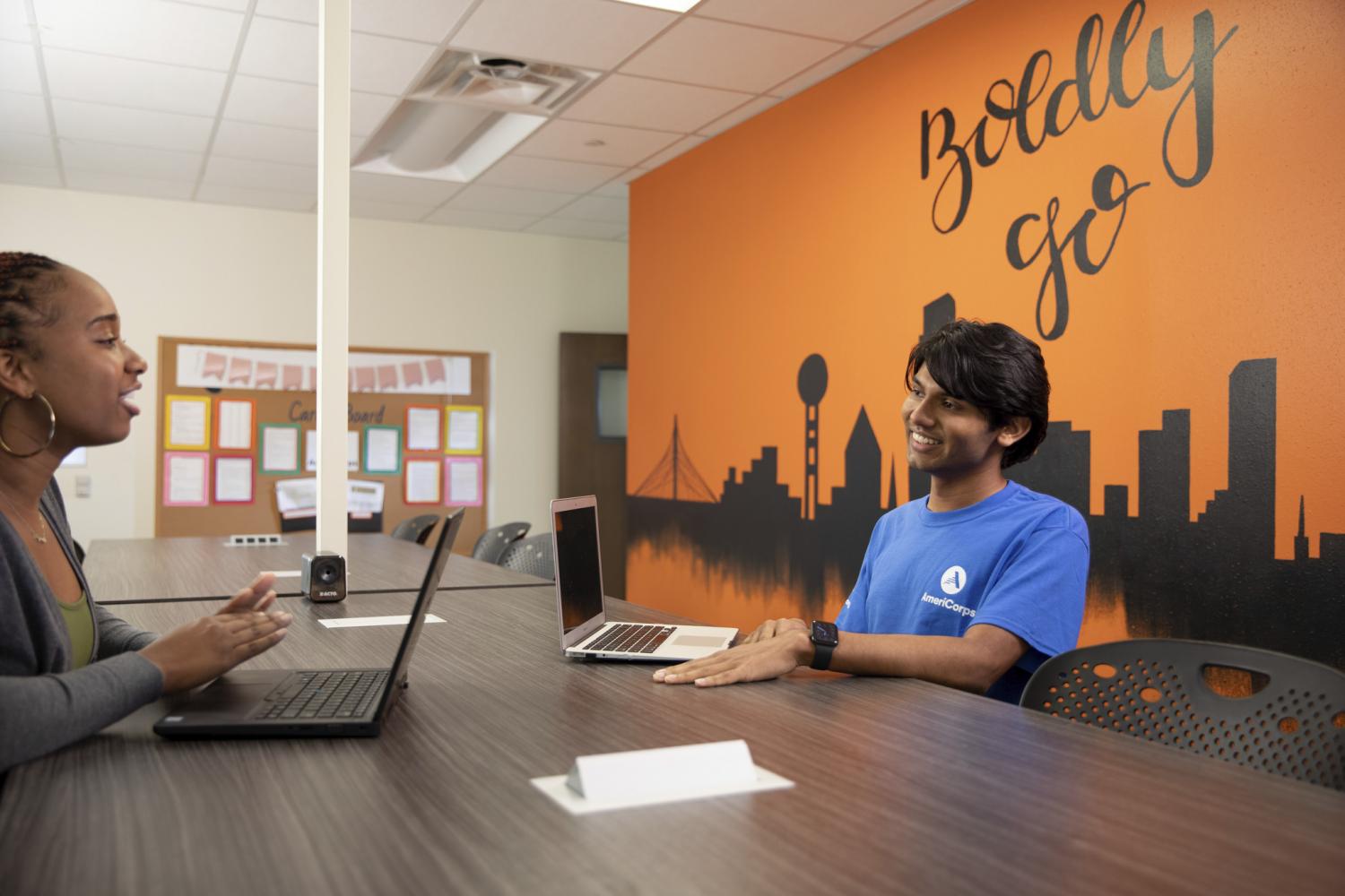 AmeriCorps Member Mushfequr works at laptop 