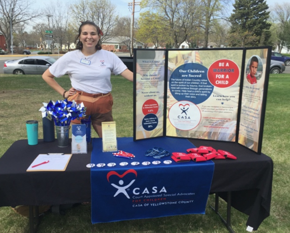 AmeriCorps member Sage working at CASA booth