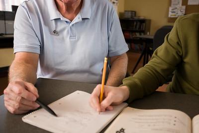 AmeriCorps Seniors volunteer tutoring a child