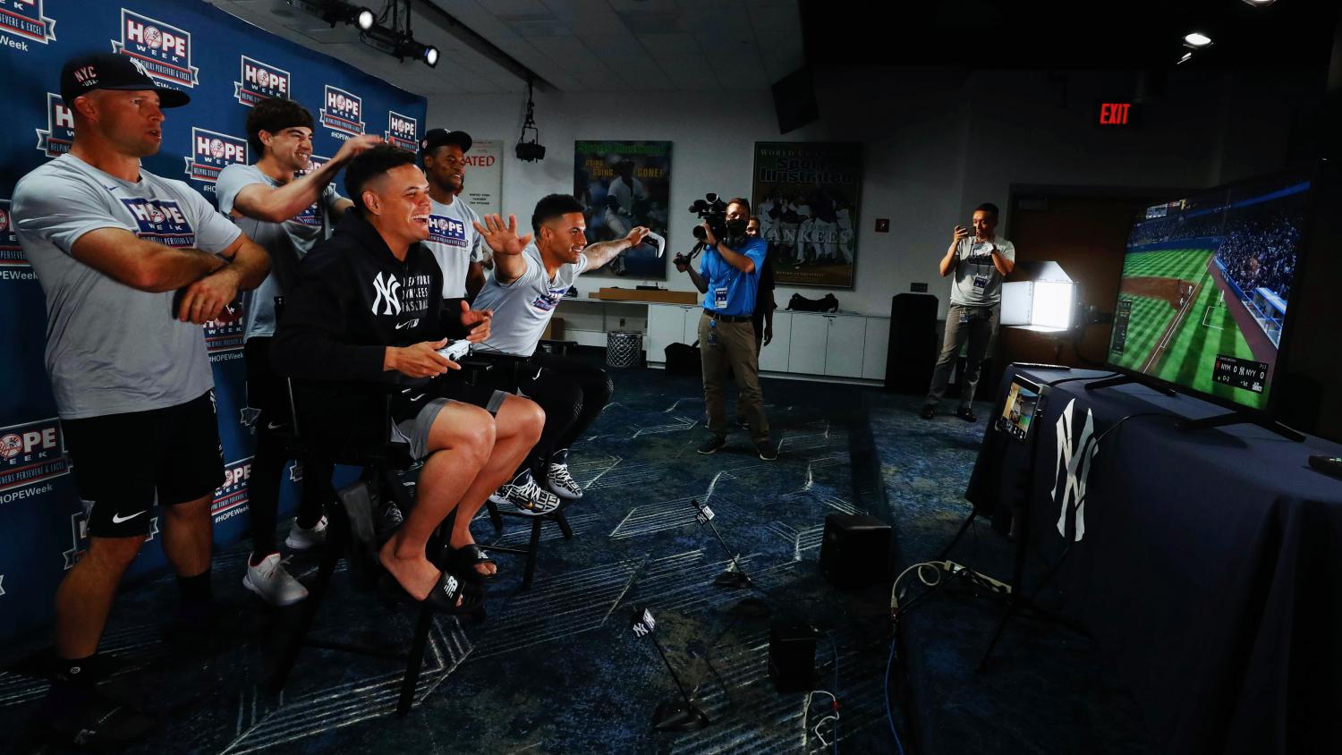 Yankees players Wade, Severino, Urshela, Torres, and Gardner talking with Luke