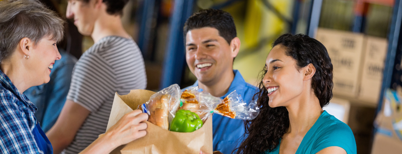 Volunteers packing food donations at a food bank.